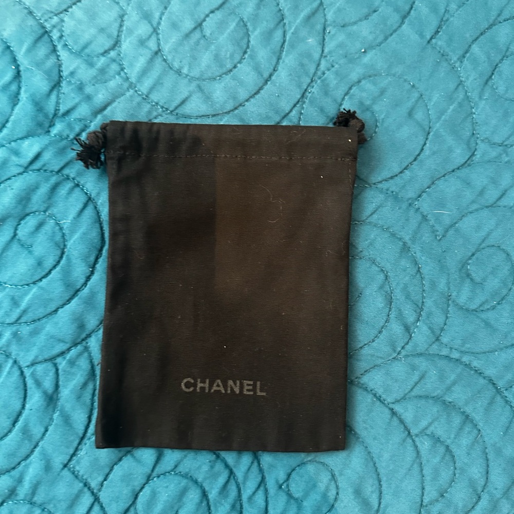 CHANEL Classic Black mini drawstring pouch approximately 3”x5”